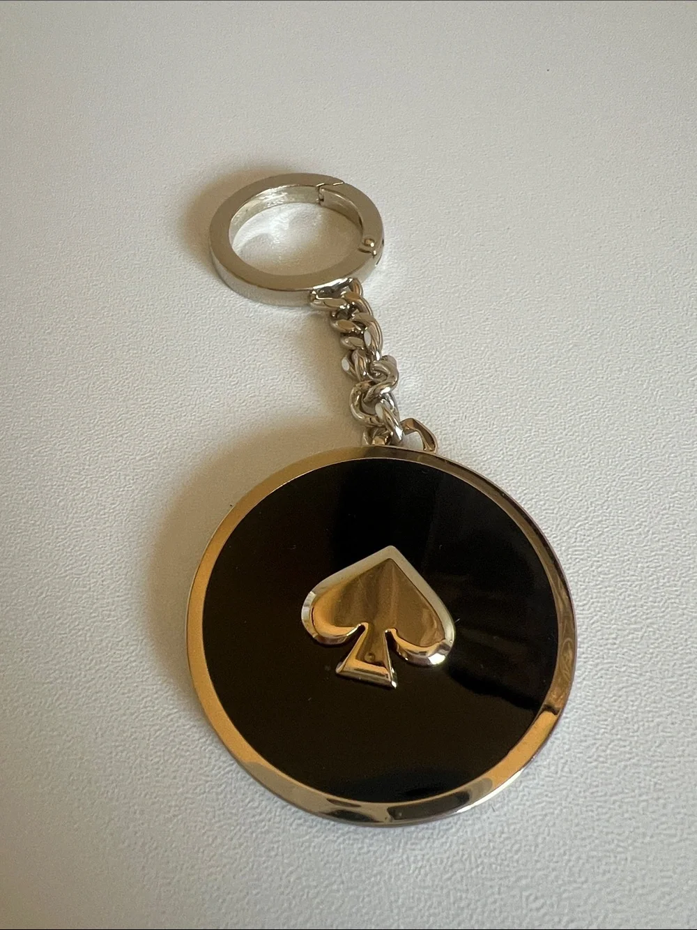 kate spade Black and Gold Round Spade Keychain